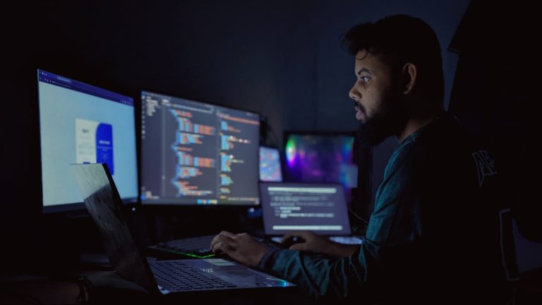 Developer workspace with analytics screens and content workflow