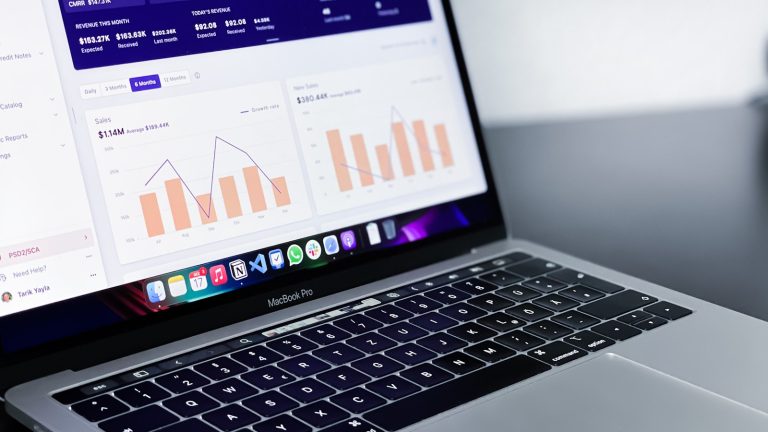 Premium technical workspace showing AI automation planning on a laptop