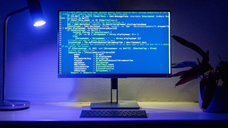 Developer workspace showing code and automation tools on a laptop screen