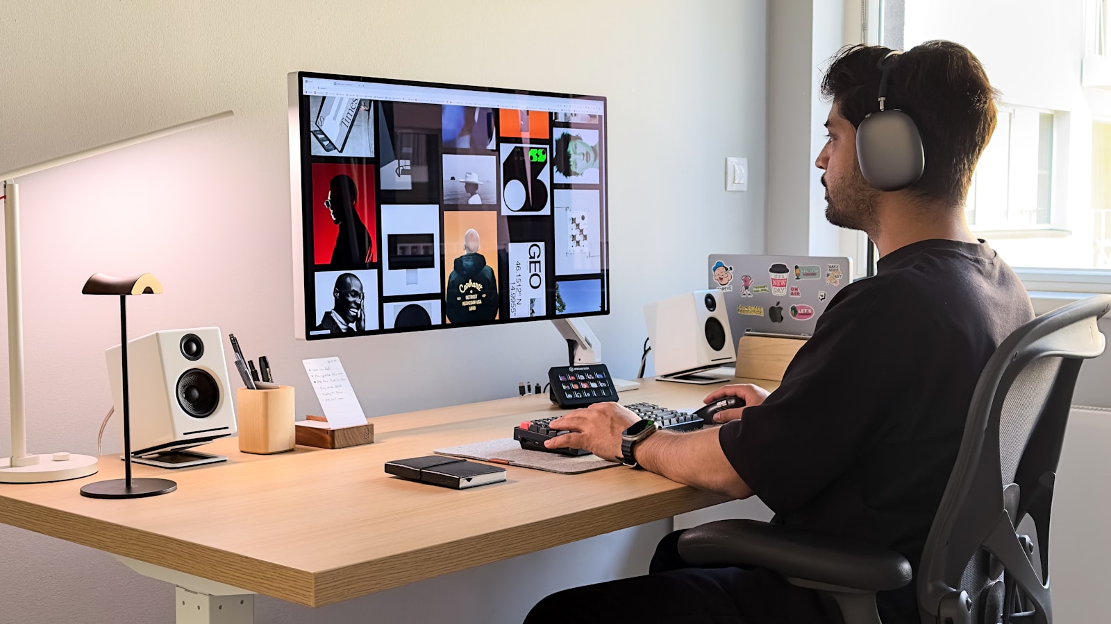 A modern workspace setup for web design with a laptop and design tools.